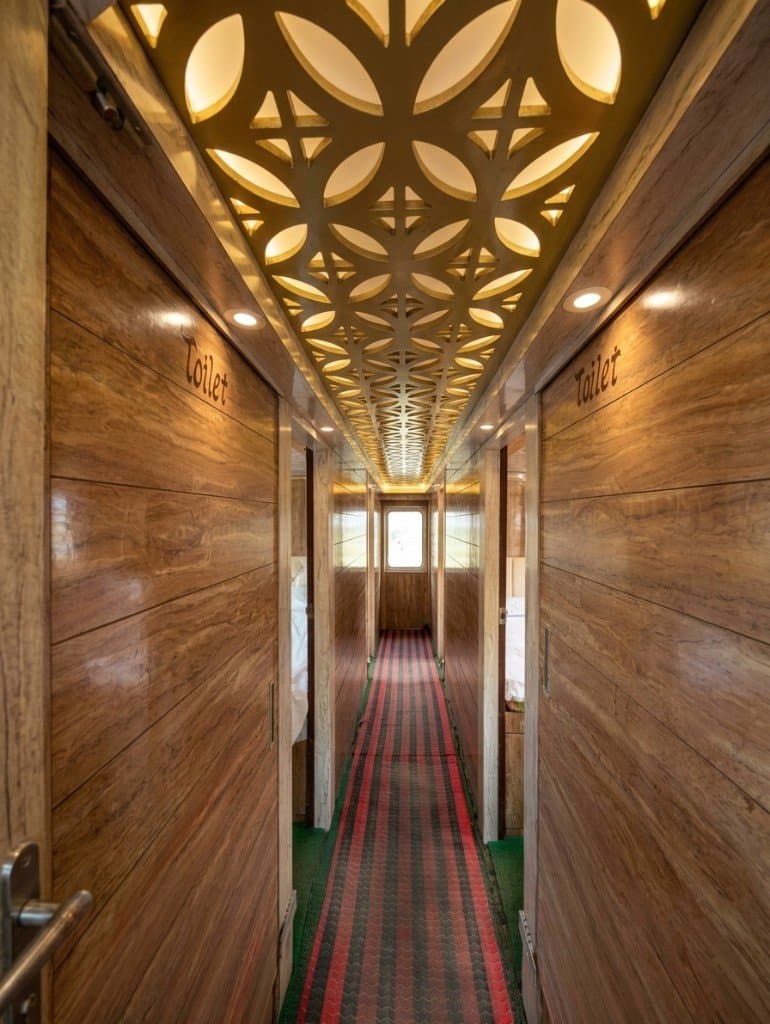 Wood cabin corridor with toilet cabins aboard a Mangrove Forest Camp Sundarban safari boat