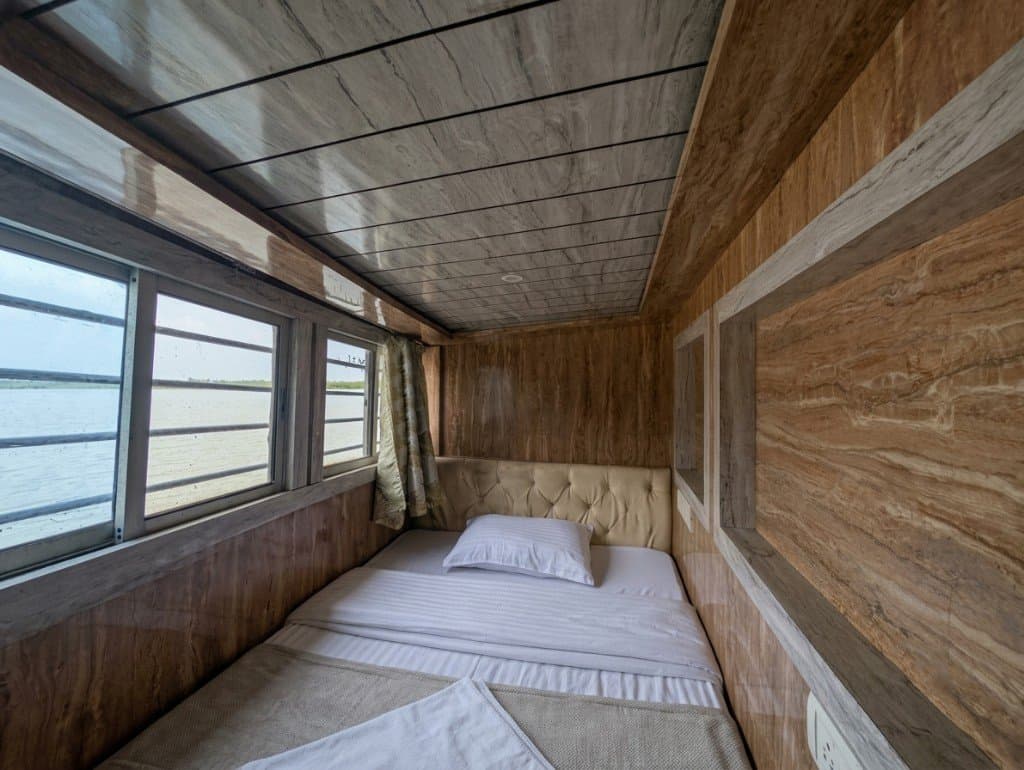 River-view cabin bunk on a Mangrove Forest Camp Sundarban safari boat