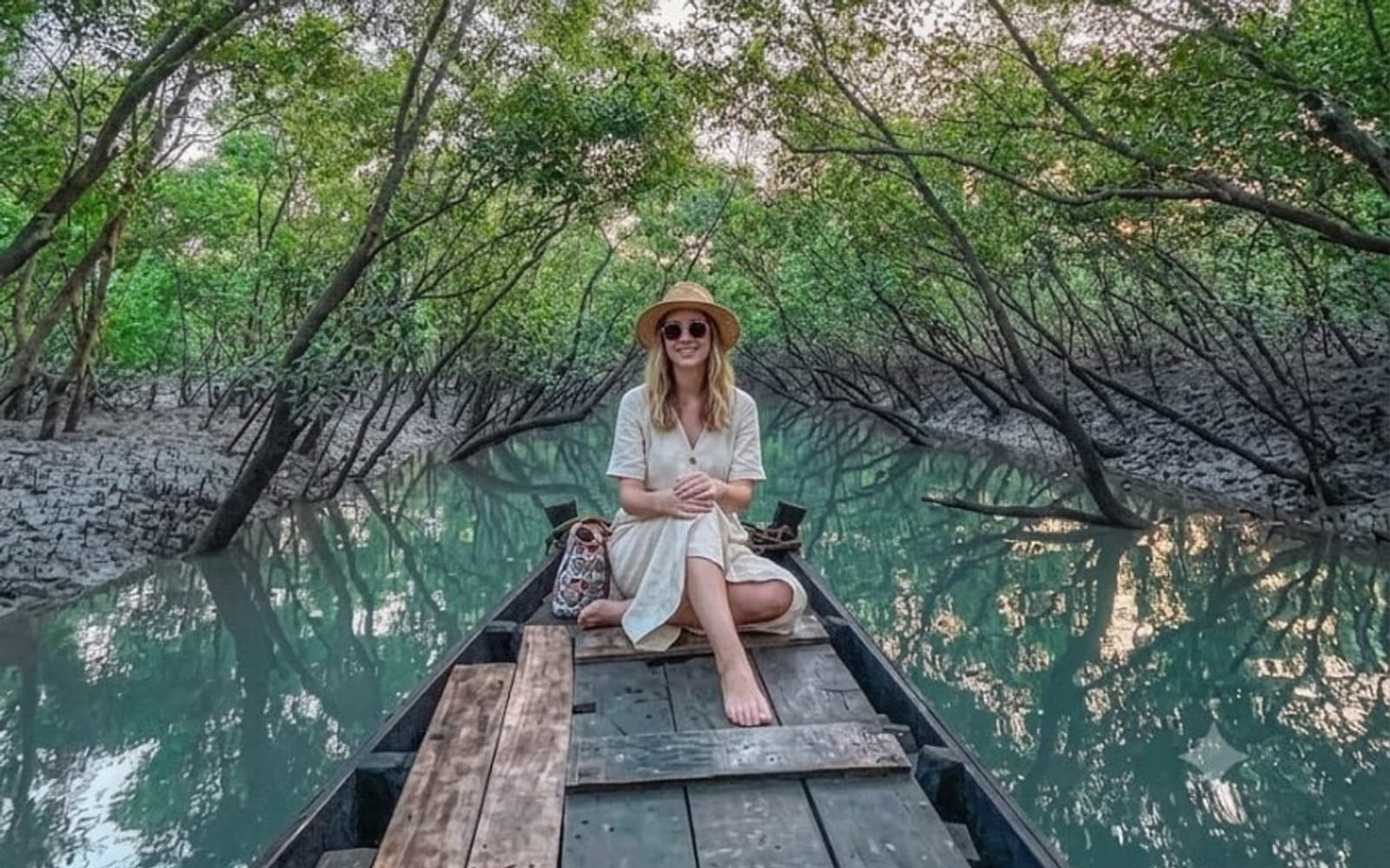 Traditional country boat ride through a Sundarban mangrove creek near Mangrove Forest Camp